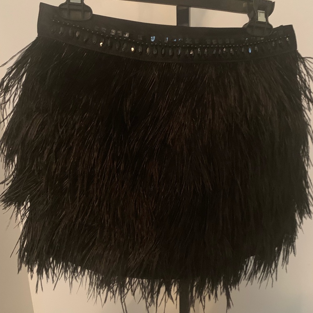 Express feathered w/stones skirt
